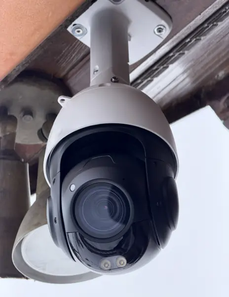 PTZ surveillance camera mounted under a soffit